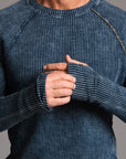 A man modeling a One Golden Thread Waffle Long Sleeve Raglan shirt in blue mineral
