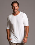 Male modeling white crew neck shirt