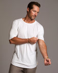 Male modeling white crew neck shirt