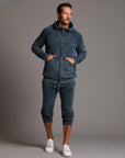 man modeling pants in mineral blue