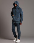 man modeling pants in mineral blue