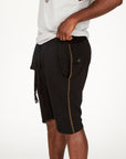 A man modeling black milanos mid shorts