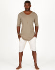 A man modeling white stone milanos mid shorts