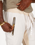 A man modeling white stone milanos mid shorts
