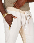 A man modeling white stone milanos mid shorts