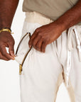 A man modeling white stone milanos mid shorts