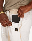 A man modeling white stone milanos mid shorts