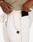 A man modeling white stone milanos mid shorts