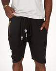 A man modeling black milanos mid shorts