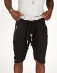 A man modeling black milanos mid shorts