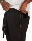 A man modeling black milanos mid shorts