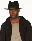 Male modeling OGT Bespoke Hat with 108 Talisman