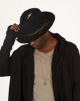Male modeling OGT Bespoke Hat with 108 Talisman