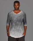 A man wearing the One Golden Thread Fleece Sweater v neck shirt in grey mineral color
