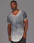 A man modeling in a grey mineral sweater v neck shirt