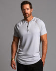 Man modeling a Blue Clay colored Short Sleeve Henley shirt