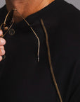 Man modeling a black Short Sleeve Henley shirt