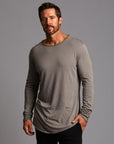 Man modeling a long sleeve crew shirt in deep clay gray