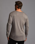 Man modeling a long sleeve crew shirt in deep clay gray