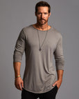 Man modeling a long sleeve crew shirt in deep clay gray