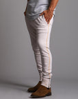 Man modeling the milano pant in white stone