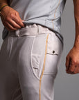 Man modeling the milano pant in white stone