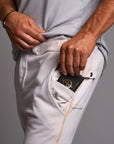 Man modeling the milano pant in white stone