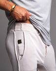 Man modeling the milano pant in white stone