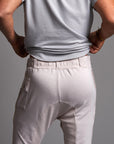 Man modeling the milano pant in white stone