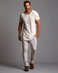 Man modeling a milano pants in white stone
