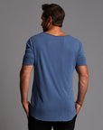 Male modeling blue crew neck shirt
