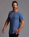 Male modeling blue crew neck shirt