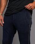 Man modeling the milano pant in blue mineral