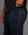 Man modeling the milano pant in blue mineral