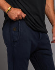 Man modeling the milano pant in blue mineral