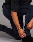 Man modeling the milano pant in blue mineral