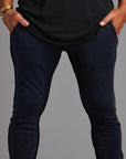 Man modeling the milano pant in blue mineral