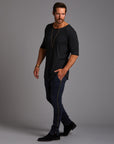Man modeling the milano pant in blue mineral