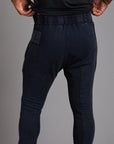 Man modeling the milano pant in blue mineral