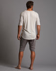 A man modeling deep clay gray milanos mid shorts