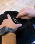Man tailoring the OGT Bespoke Hat