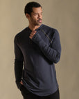 Male modeling blue long sleeve henley