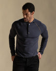 Male modeling blue long sleeve henley