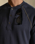 Male modeling blue long sleeve henley