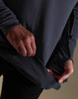 Male modeling blue long sleeve henley