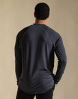 Male modeling blue long sleeve henley