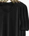 Different colored v neck three pack on clothing racks