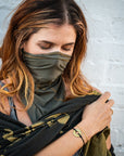 A woman wearing a Customized MyIntent Gold Plated Black Twist Bracelet