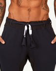 Man modeling the milano pant in charcoal blue