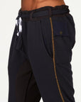 Man modeling a milano pants in charcoal blue